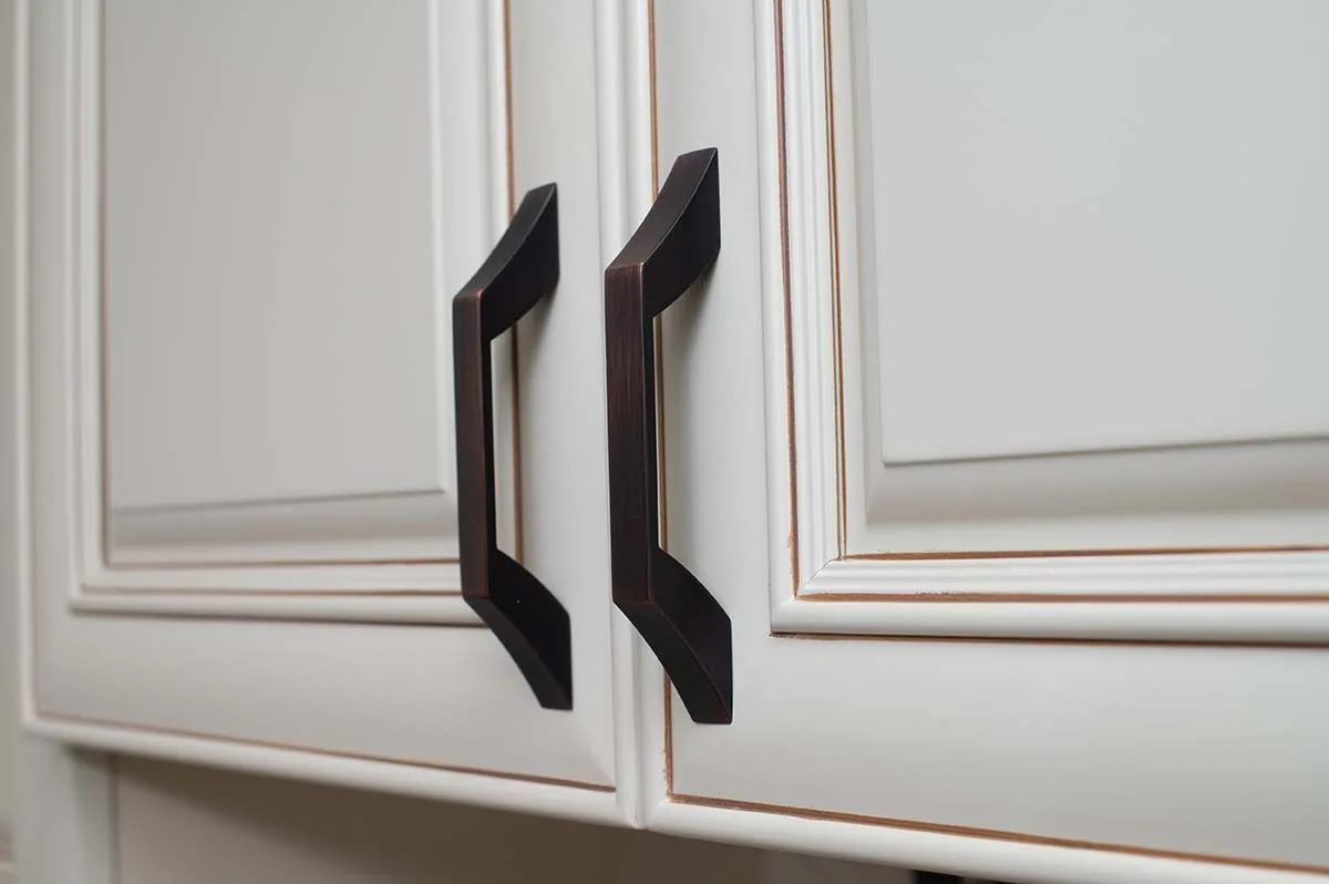 White cabinet doors with matte black handles